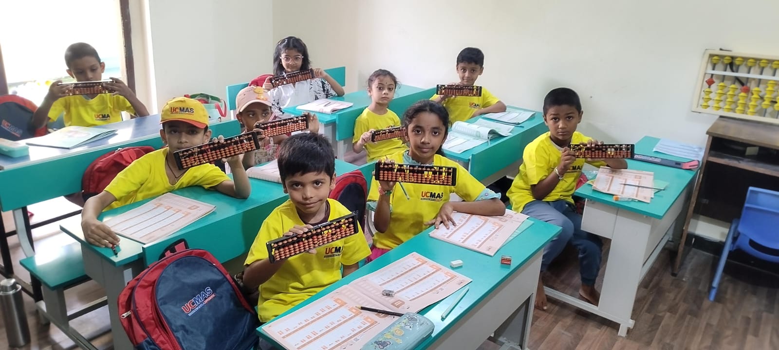 UCMAS students proudly displaying their abacus
