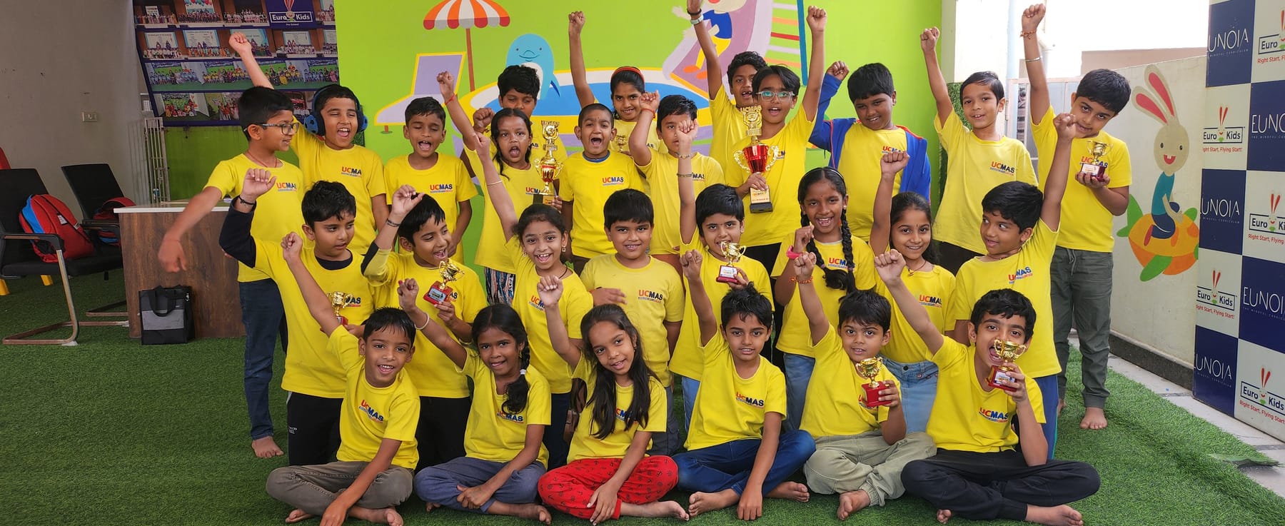 UCMAS Beeramguda students celebrating together with their trophies